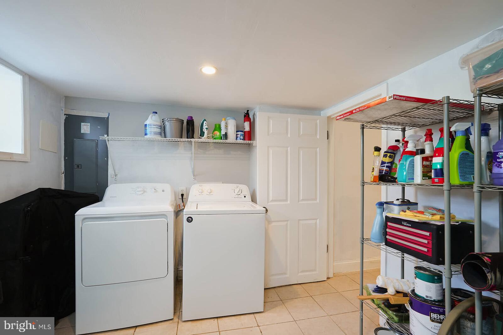 7719 Garrison Road Hyattsville, MD 20784 - Photo 21 of 23 a storage room with washer and dryer