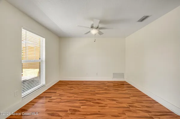 a view of a livingroom with furniture and a window