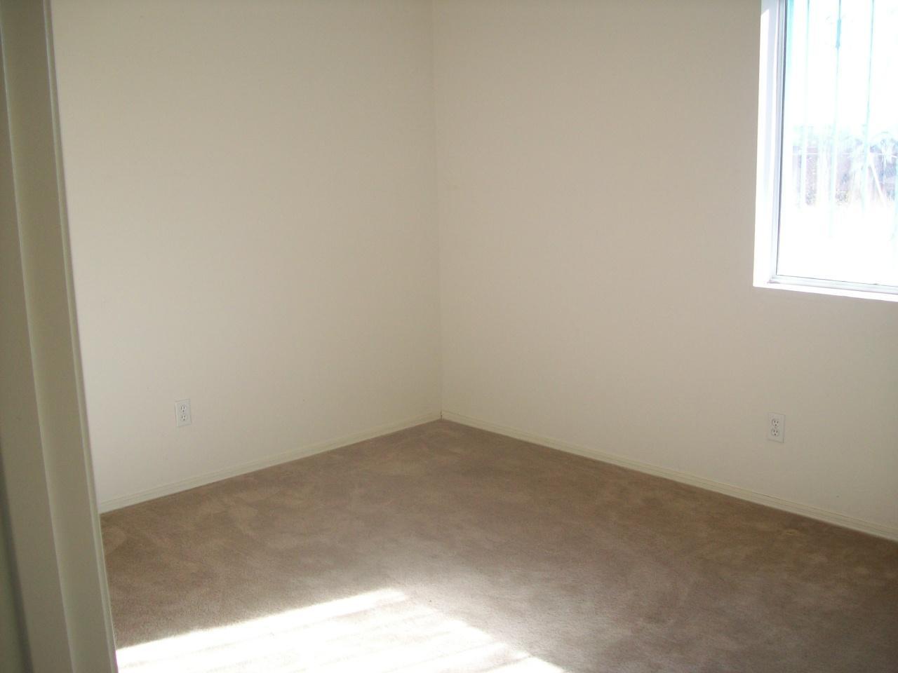 485 Alondra Court Rio Rico, AZ 85648 - Photo 9 of 13 a view of a small space with wooden floor and a window