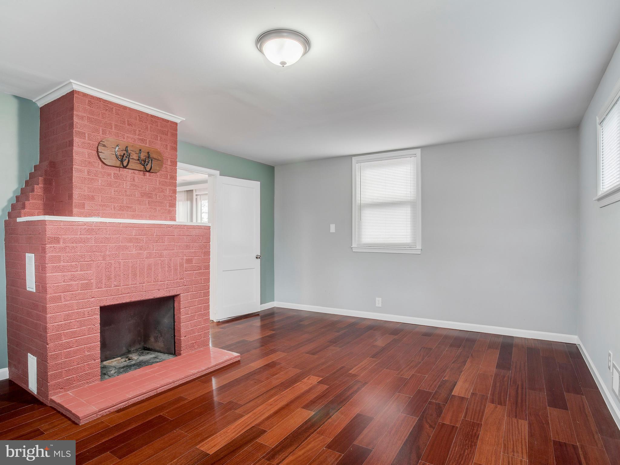 4207 Maple Road Morningside, MD 20746 - Photo 15 of 30 Family Room with wood-burning fireplace