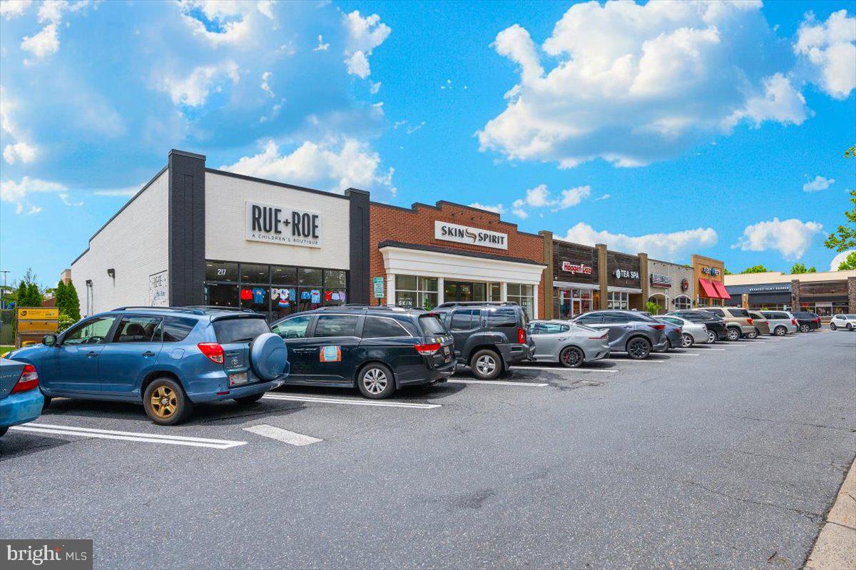 7 Booth Street, Unit 406 Gaithersburg, MD 20878 - Photo 105 of 117 a view of a cars park in front of a building