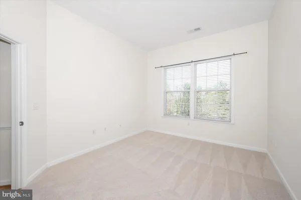 a living room with furniture wooden floor and a fireplace