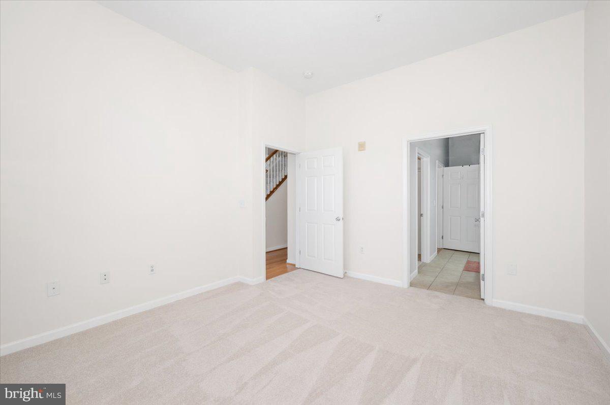7 Booth Street, Unit 406 Gaithersburg, MD 20878 - Photo 38 of 117 Primary bedroom with new carpet