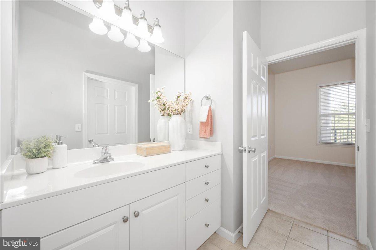 7 Booth Street, Unit 406 Gaithersburg, MD 20878 - Photo 42 of 117 a bathroom with a sink vanity and a mirror