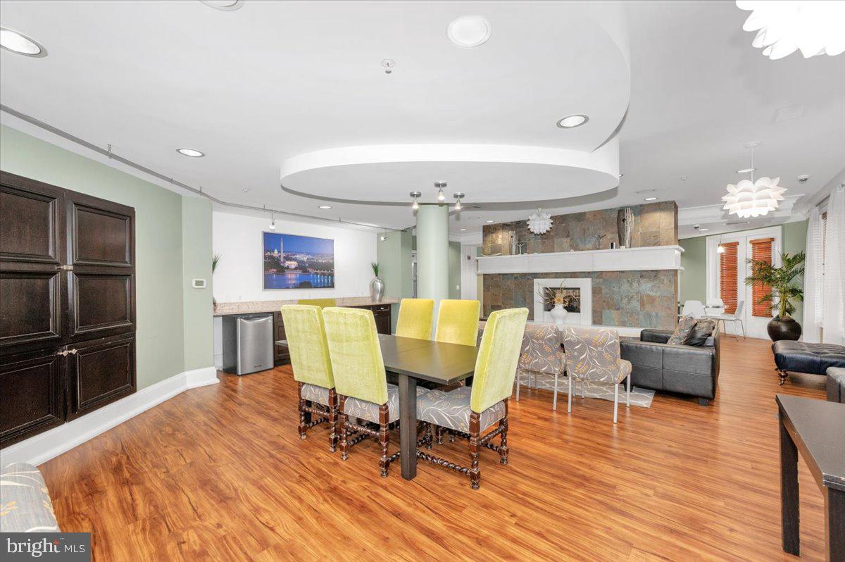 7 Booth Street, Unit 406 Gaithersburg, MD 20878 - Photo 59 of 117 a living room with furniture wooden floor and a fireplace