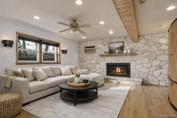a living room with furniture and a fireplace