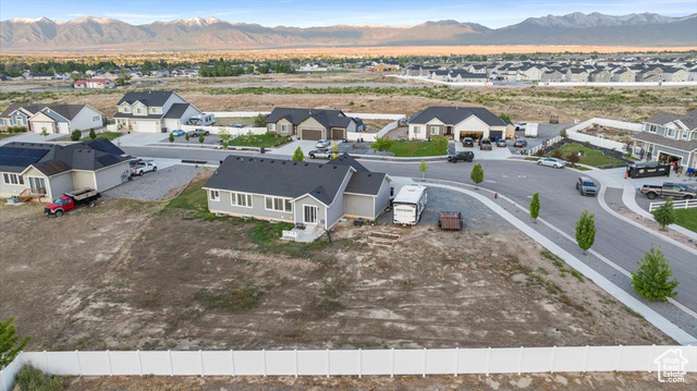 464 South Trejo Rdg Road Grantsville, UT 84029 - Photo 32 of 33 Aerial view of residential area with a mountain backdrop