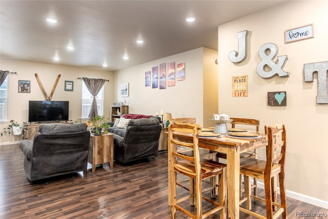 980 Dry Creek Road Hayden, CO 81639 - Photo 12 of 19 a living room with furniture a flat screen tv and a table
