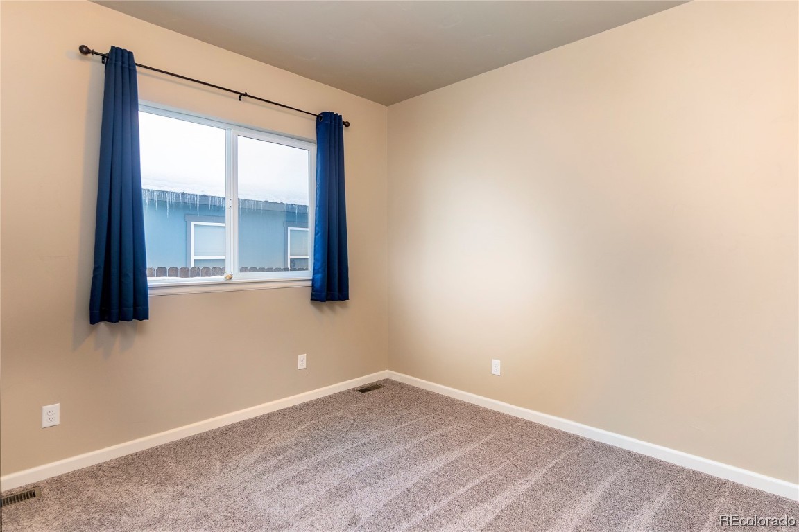 980 Dry Creek Road Hayden, CO 81639 - Photo 6 of 19 a view of an empty room with a window