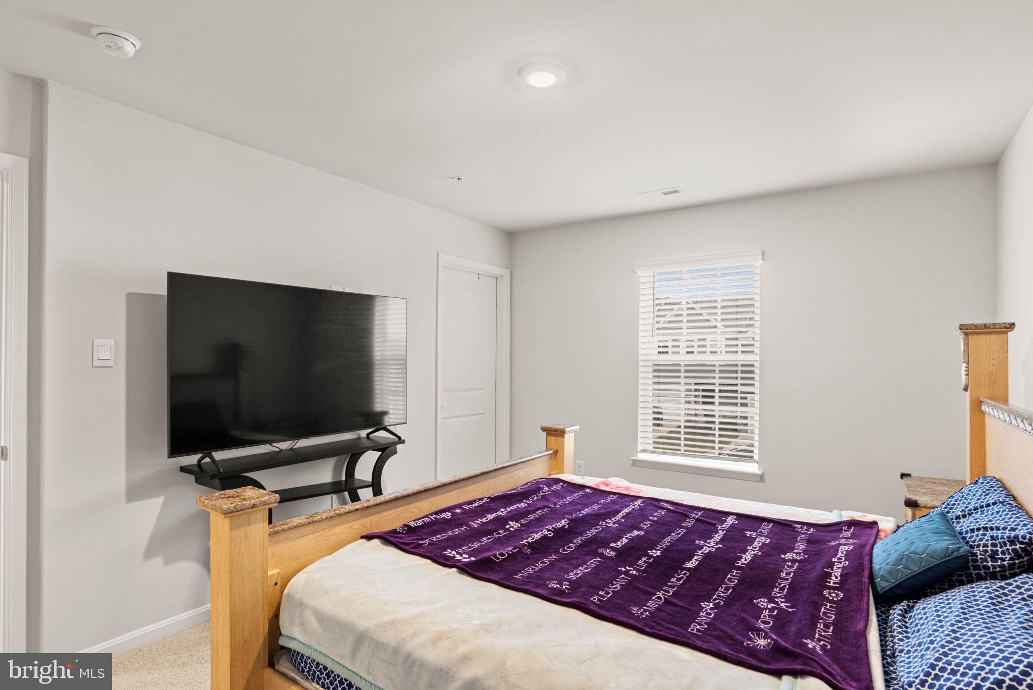 310 Maple Run Drive York, PA 17404 - Photo 14 of 28 a bedroom with a bed and a flat screen tv