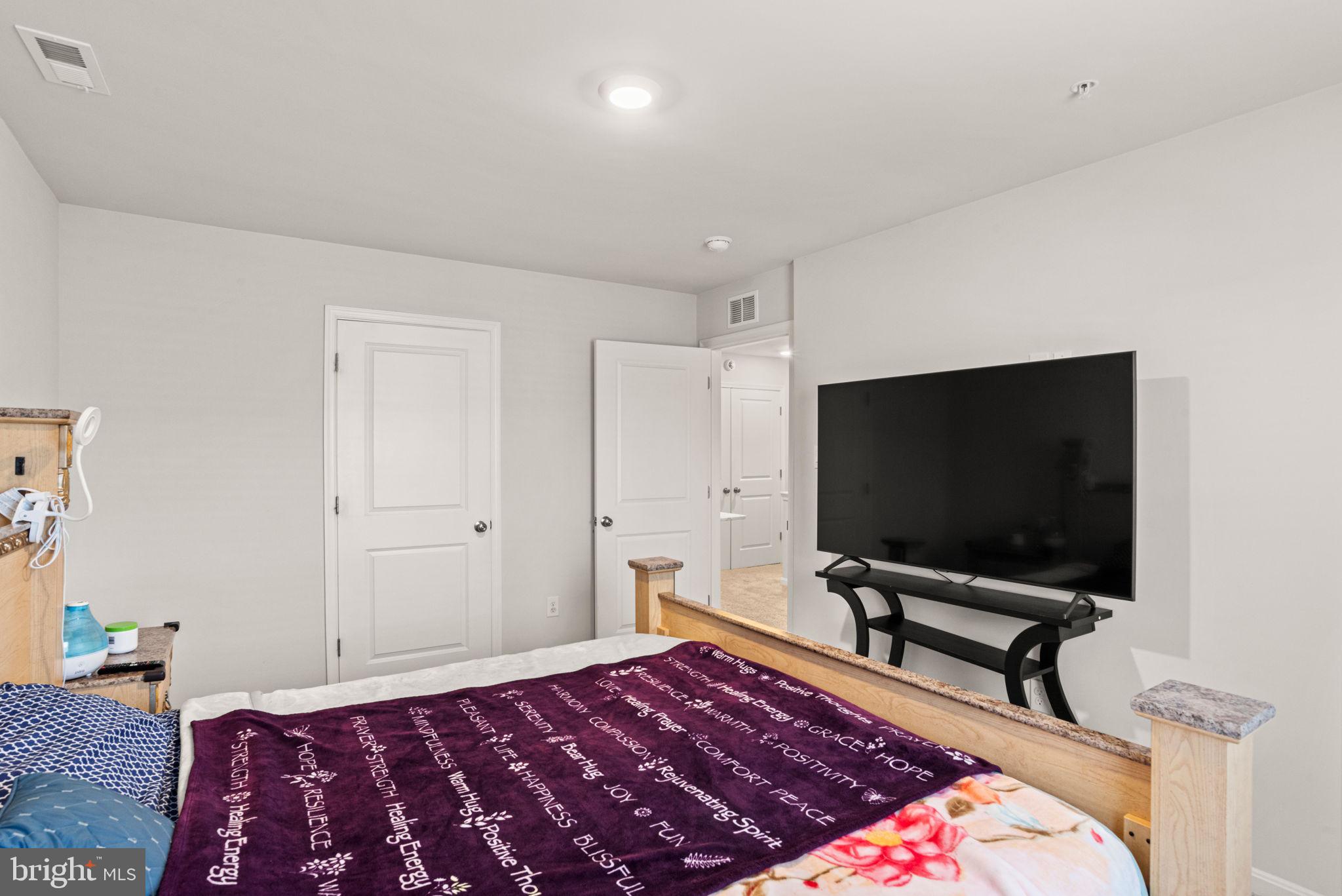 310 Maple Run Drive York, PA 17404 - Photo 15 of 28 a bedroom with a bed and a flat screen tv