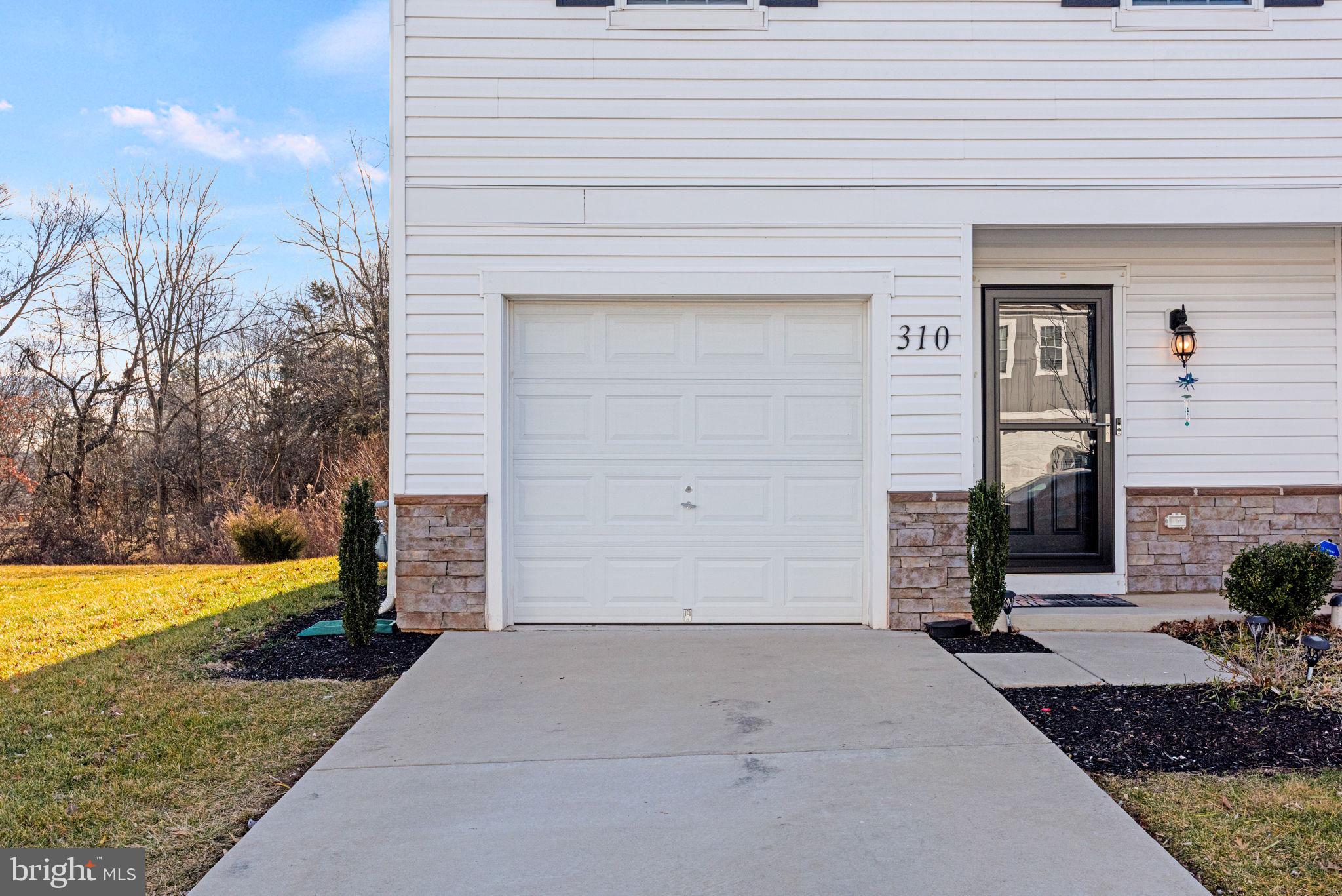 310 Maple Run Drive York, PA 17404 - Photo 25 of 28 a front view of a house with garden