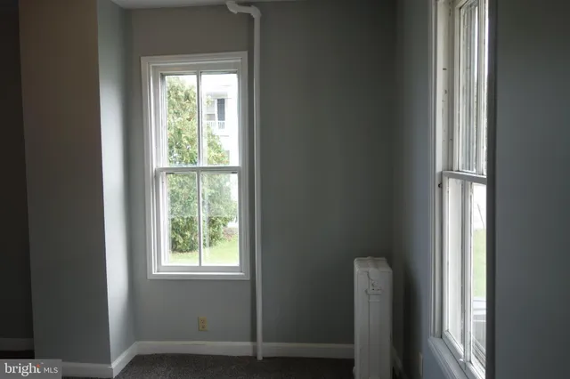 a view of an empty room and window