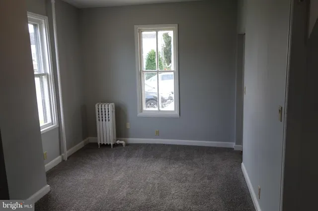 an empty room with windows