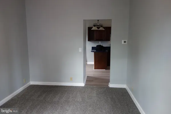 a view of a storage & utility room with a closet