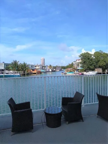a terrace with outdoor seating and city view