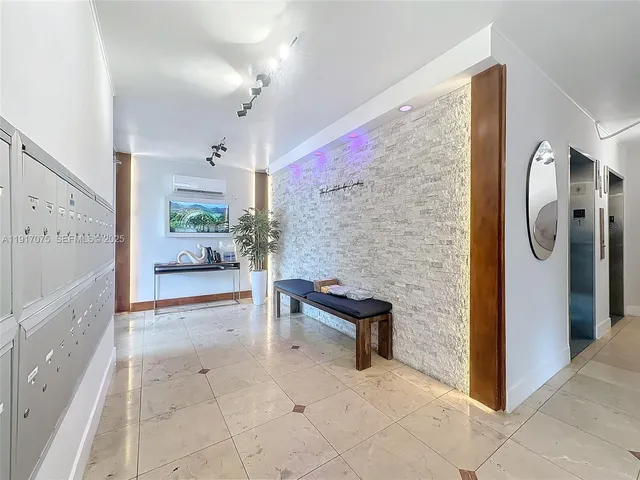 a spacious bathroom with a tub shower and mirror