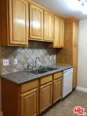a view of cabinets and window