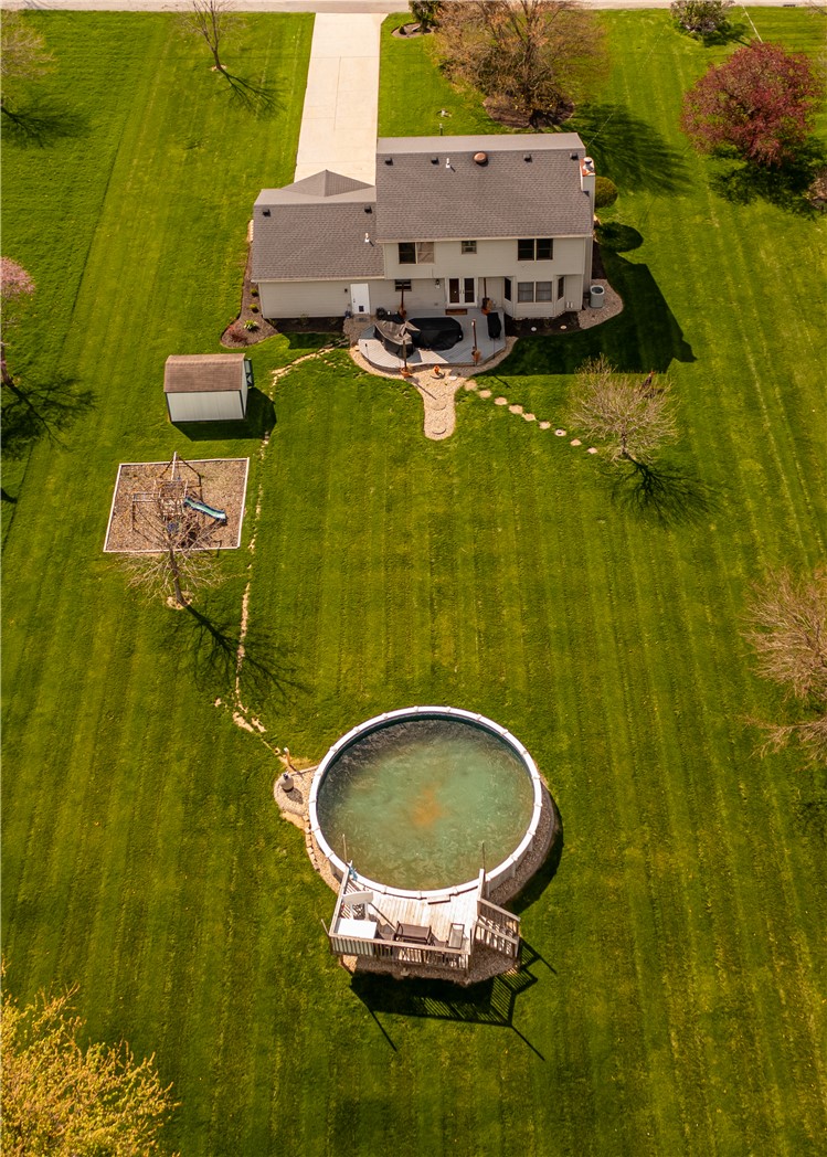 3628 Petre Road Springfield, OH 45502 - Photo 49 of 52 An aerial view showcases a vibrant green yard with a private pool and charming play area.