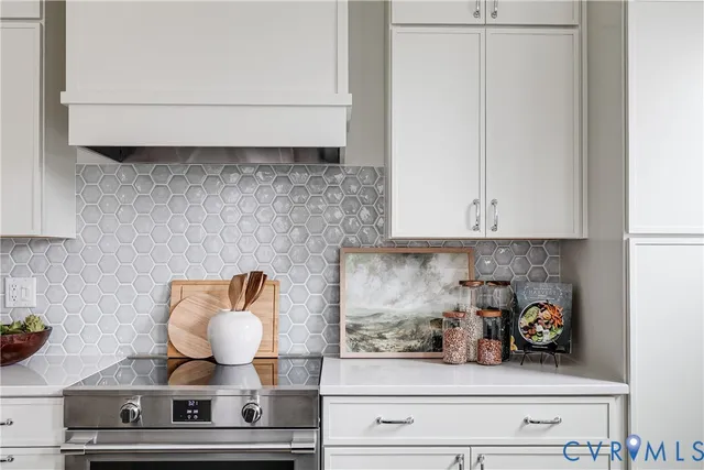 a kitchen with a stove and cabinets