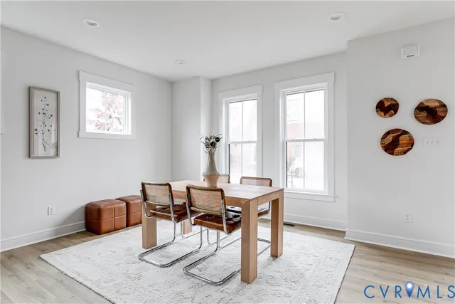 a view of a livingroom with furniture and a window