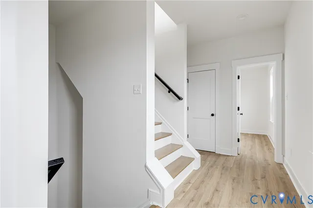 a view of entryway with wooden floor