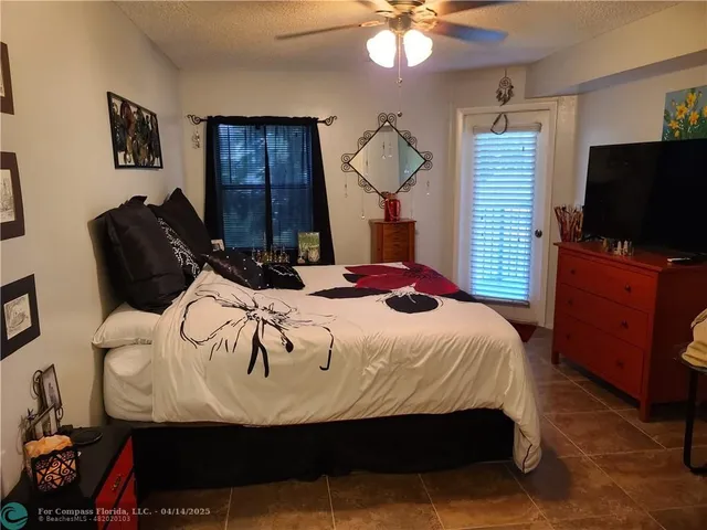 a bathroom with a sink a toilet a mirror and shower