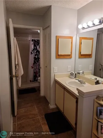 a bathroom with a sink and toilet