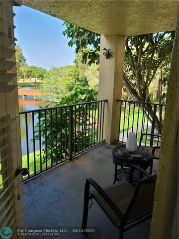 a view of a lake with a house in the background