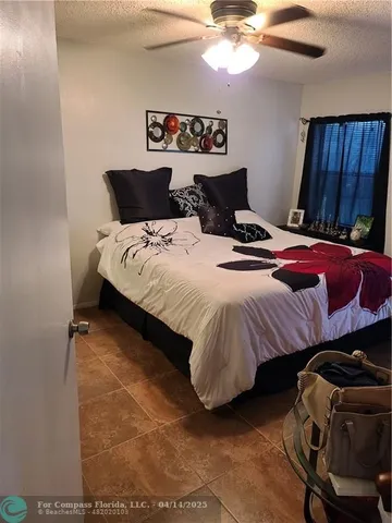 a bedroom with bed and tv