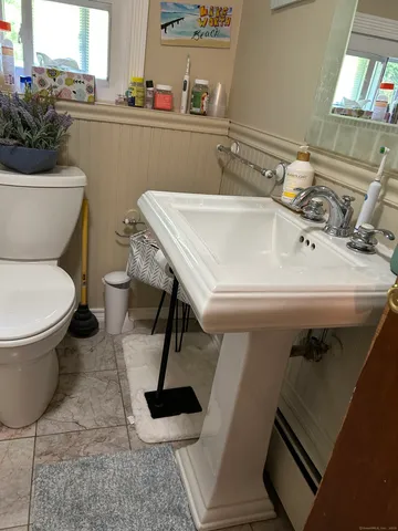 a bathroom with a sink and toilet