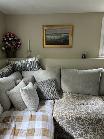 a living room with furniture and a couch