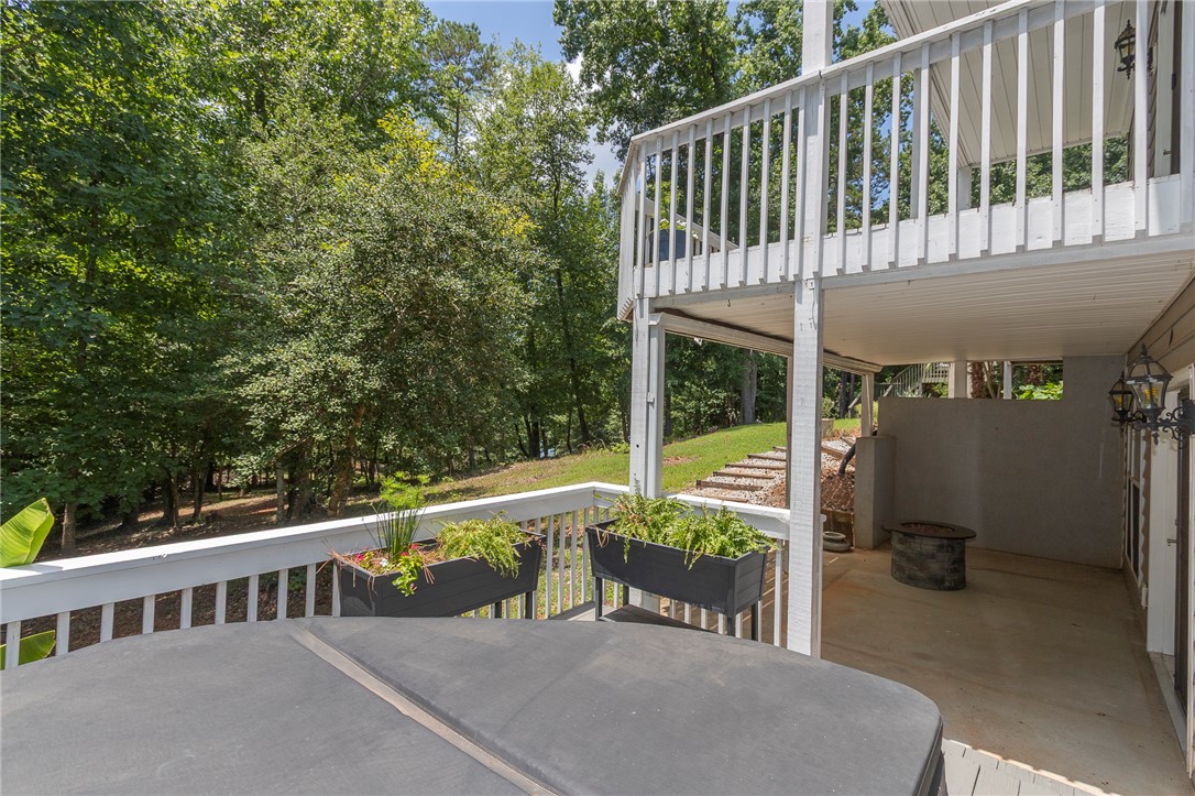 125 Inlet Pointe Drive Anderson, SC 29625 - Photo 36 of 39 A spacious wooden deck provides ample room for a hot tub and outdoor entertainment, overlooking the lake