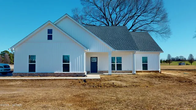 a house with trees in the background