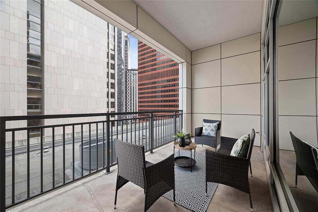 301 Fifth Avenue, Unit 506 Pittsburgh, PA 15222 - Photo 17 of 21 a view of balcony with a potted plant and outdoor seating