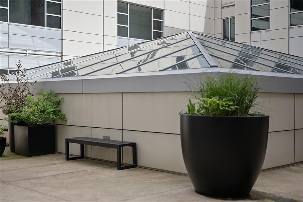 301 Fifth Avenue, Unit 506 Pittsburgh, PA 15222 - Photo 20 of 21 a potted plant sitting on the side of a building