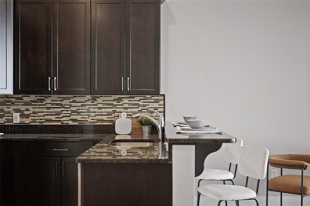 301 Fifth Avenue, Unit 506 Pittsburgh, PA 15222 - Photo 7 of 21 a kitchen with a stove and a cabinets