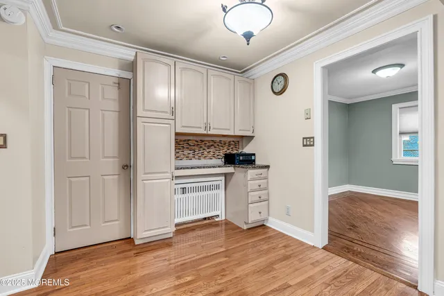 a kitchen with granite countertop a refrigerator and a sink