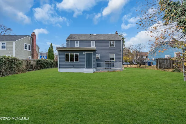 an aerial view of residential building and lake view in back