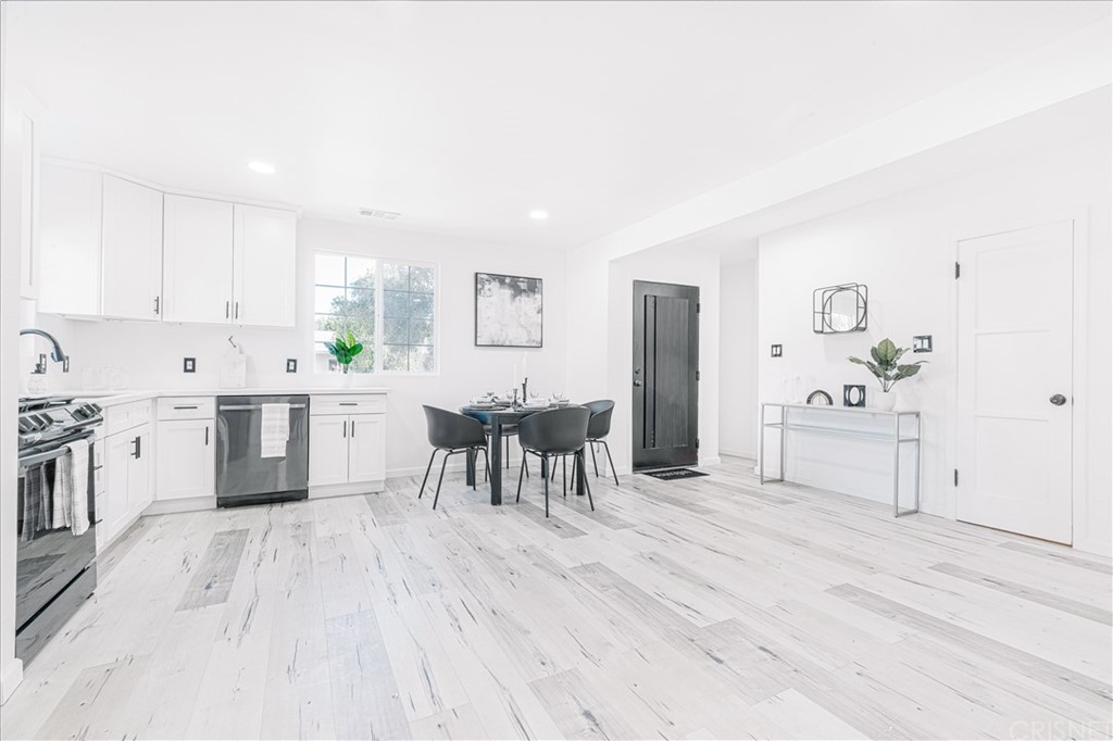 6725 Belmar Avenue Reseda, CA 91335 - Photo 13 of 32 a view of a kitchen with table and chairs