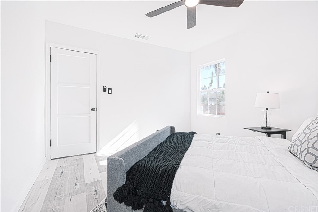 6725 Belmar Avenue Reseda, CA 91335 - Photo 25 of 32 a bed room with a bed and a window