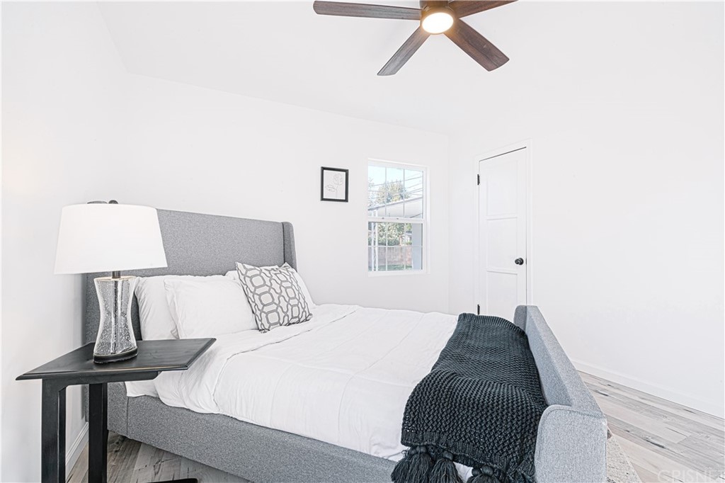 6725 Belmar Avenue Reseda, CA 91335 - Photo 26 of 32 a bedroom with a bed and window