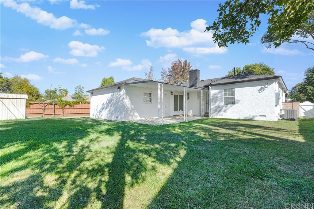 6725 Belmar Avenue Reseda, CA 91335 - Photo 5 of 32 a view of a house with a backyard