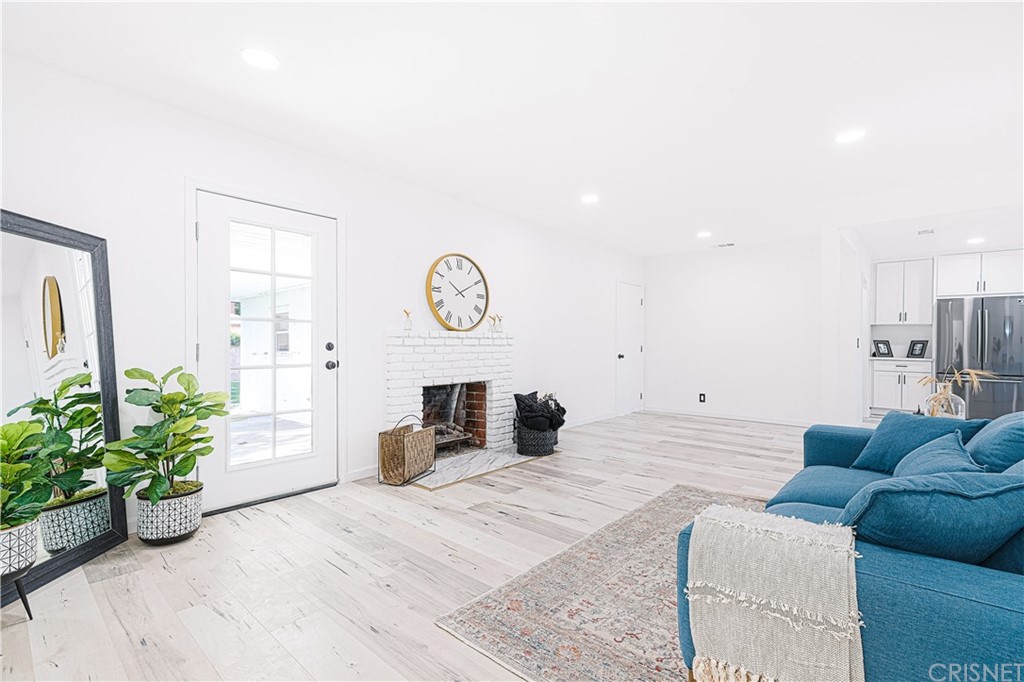 6725 Belmar Avenue Reseda, CA 91335 - Photo 8 of 32 a large bedroom with a bed and a couch