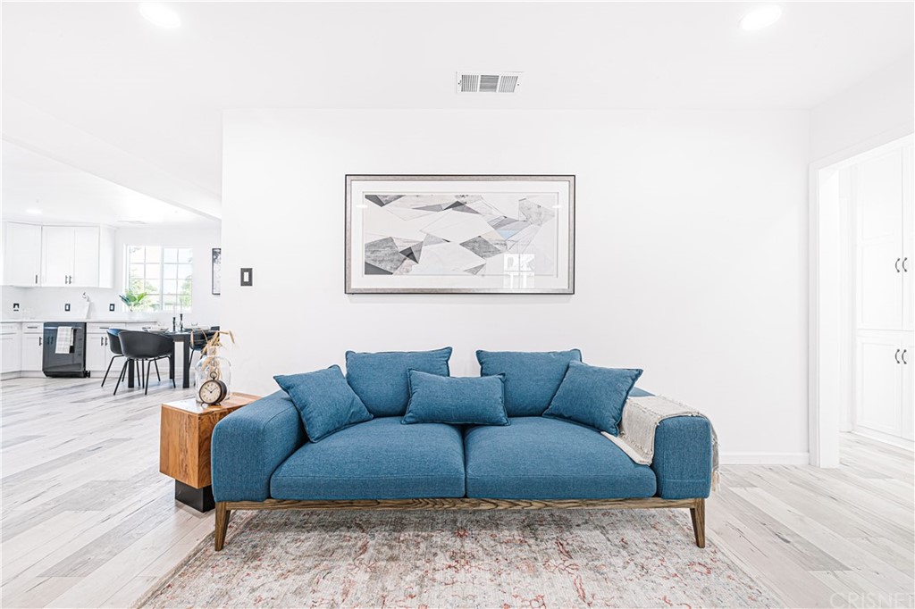 6725 Belmar Avenue Reseda, CA 91335 - Photo 10 of 32 a living room with furniture and wooden floor