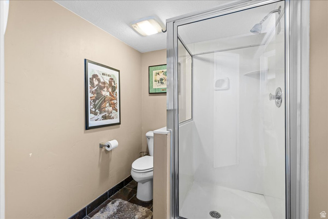 7824 South Sequoia Tree Lane Sandy, UT 84094 - Photo 33 of 43 Full bathroom with toilet and a shower stall