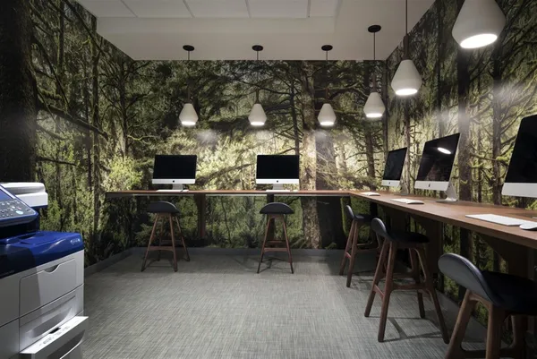 a kitchen with stainless steel appliances kitchen island granite countertop a sink and a stove