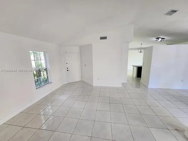 a view of an empty room with a window