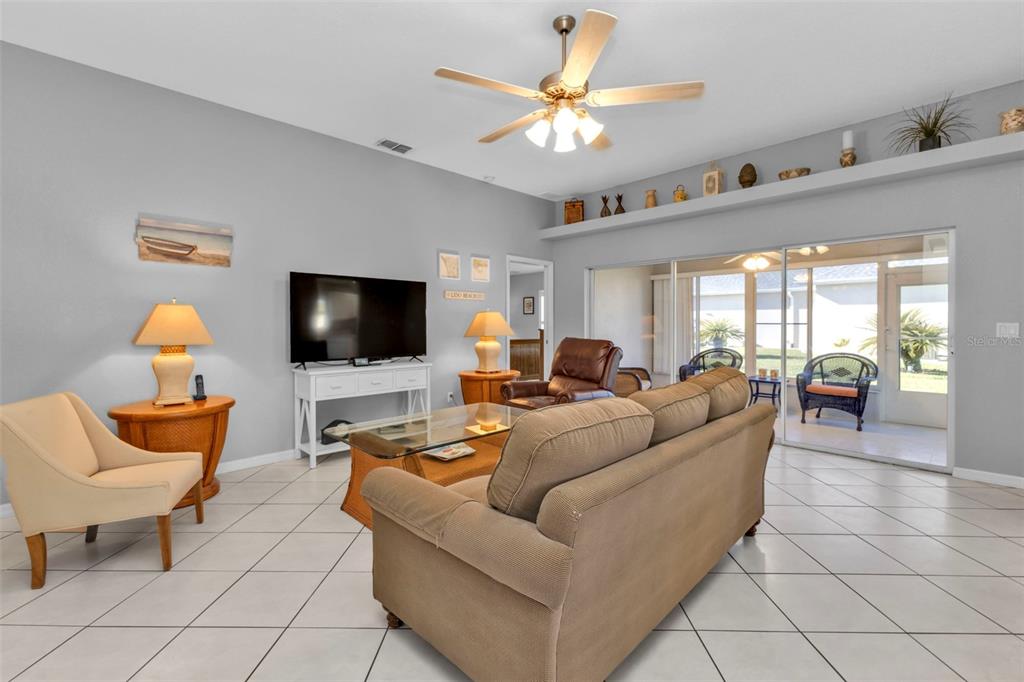 24415 Buckingham Way Punta Gorda, FL 33980 - Photo 11 of 41 a living room with furniture and a flat screen tv