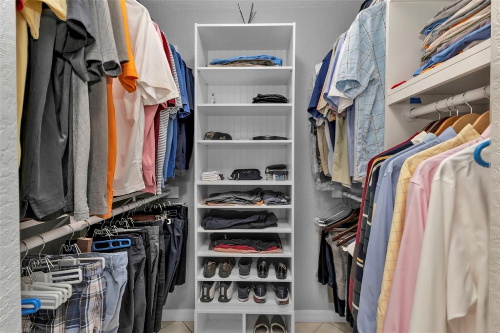 24415 Buckingham Way Punta Gorda, FL 33980 - Photo 14 of 41 a view of walk in closet with clothes and shoes